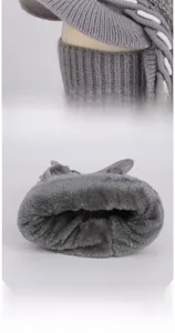 Detailed macro view of the thick gray thermal plush lining and knitted neck warmer fabric