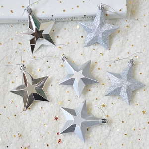 Close-up of 6-piece silver star ornaments in shiny, matte, and glitter textures