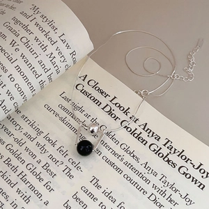 Minimalist 925 sterling silver necklace featuring a sleek black onyx bead pendant