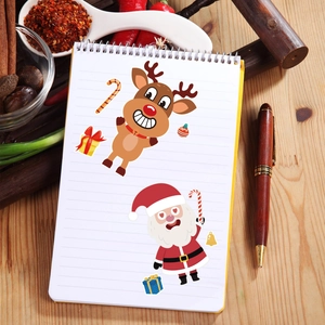 DIY Christmas stickers for kids featuring Santa and reindeer on wooden background