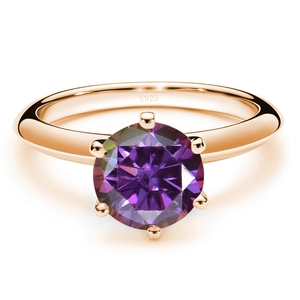 Macro detail of S925 engraved stamp on a rose gold six-prong ring with purple stone