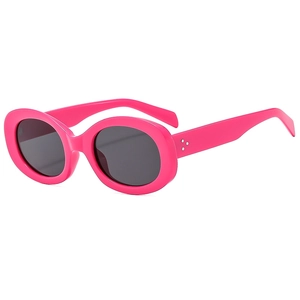 Fashionable pink oval sunglasses with metallic studs and dark lenses on white background