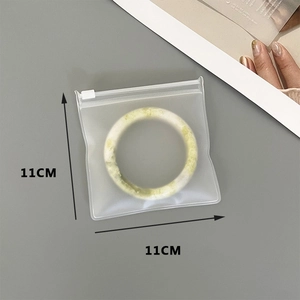 Detailed view of an 11x11cm thickened EVA jewelry storage bag with a round bracelet