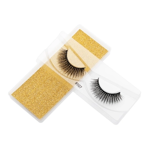 Detailed view of model #107 3D faux mink eyelashes with thick texture in gold packaging