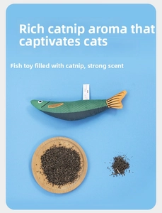 Detailed view of catnip-filled simulation fish toy with dried catnip herb on blue background