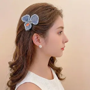 Elegant blue floral hair clip with pearl embroidery for stylish side fringe styling
