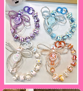 Lot de quatre bijoux de téléphone mignons avec miroir et nœud perlé