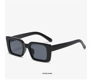 Detailed 45-degree side view of vintage square black sunglasses with thick frames