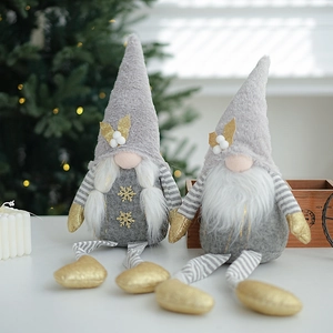 Set of two grey Christmas gnomes with gold snowflakes and long striped legs for holiday decor
