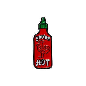Cartoon chili sauce bottle enamel pin with rooster and You're Hot text for backpacks