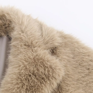 Detail shot of soft khaki faux fur texture with long fluffy fibers on this coat