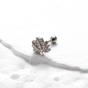 Detailed view of silver stainless steel maple leaf stud earring with cubic zirconia