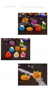 Detailed view of mini Halloween resin pumpkins and ghosts for miniature garden decor