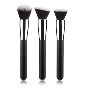 Three professional makeup brushes with black handles and chrome ferrule on white background