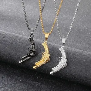 Street style engraved pistol pendants in silver and gold steel finishes on leather stands