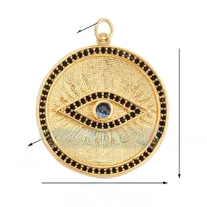 Detailed view of evil eye charm with blue zircon, black crystals, size 25mm diameter
