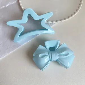 Set of pastel blue acrylic star and bow hair claw clips with high-quality metal springs