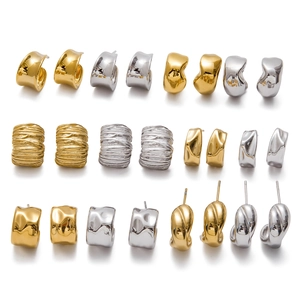 Irregular C-shaped stainless steel earrings in gold and silver with textured finishes