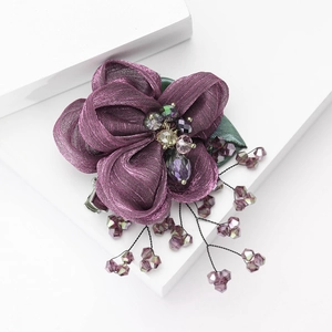 Elegant purple lace fabric flower brooch featuring crystal beads and tassel wire details