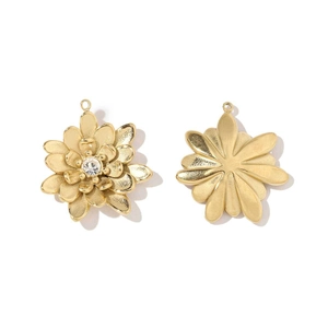Detail of two-tone gold daisy flower pendants with crystals for DIY necklace making