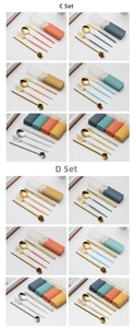 Close-up of portable stainless steel cutlery sets with flower straws and cases