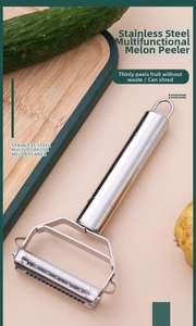 Close-up of dual-function stainless steel peeler and grater for potatoes and cucumbers