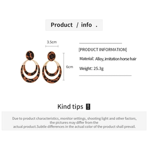 Detail view of multilayer leopard print earrings with alloy and imitation horse hair
