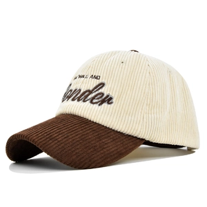 Detail of corduroy baseball cap with WONDER embroidery and two-tone brown brim