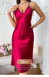 Detail of deep red satin slip dress with V-neckline and smooth silk texture