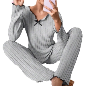 Women's grey ribbed lounge set with long sleeves and black lettuce edge trim