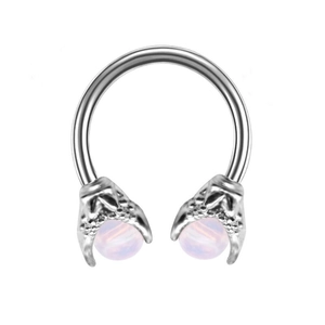 Detail of surgical steel horseshoe ring with eagle claws holding purple opal beads
