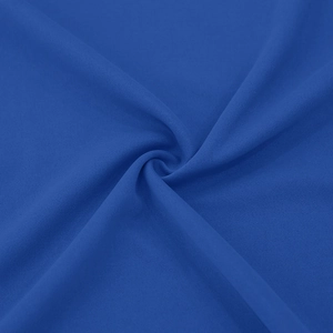 Macro detail of royal blue knitted fabric texture showing soft drape and fine weave