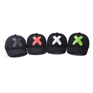 Black mesh trucker hat with bold 3D printed X logo in multiple colors on white background