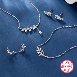 Elegant 925 sterling silver jewelry set featuring leaf pendants and cubic zirconia stones