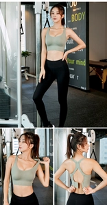 Detail view of adjustable back buckle on green sports bra for customized fitness support
