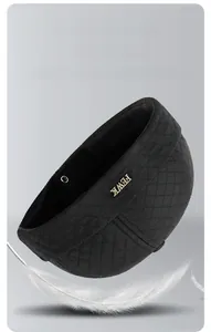 Detail of black quilted diamond stitch winter hat with FEWK gold metal logo
