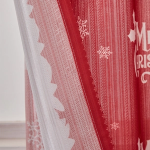 Detail of Merry Christmas printed fabric with precise stitching and white snowflakes
