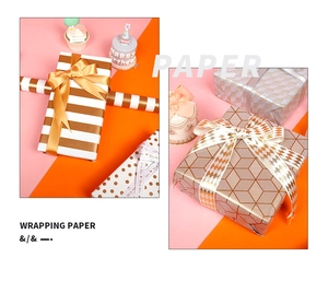 Detail of gold foil wrapping paper with dots, stripes and Mr & Mrs satin ribbons