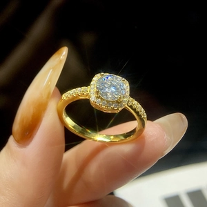 Detail of S925 silver moissanite ring with large center stone and gold finish