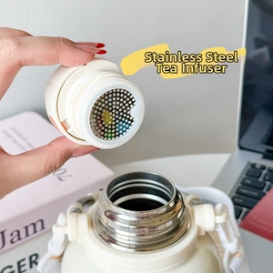 Detail of the 316 stainless steel tea infuser and white lanyard on the thermos flask