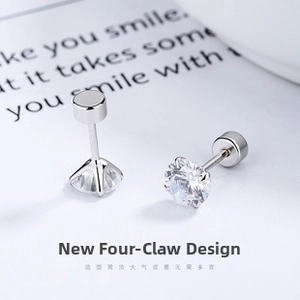 Close-up of 925 sterling silver four-prong stud with secure flat screw back design