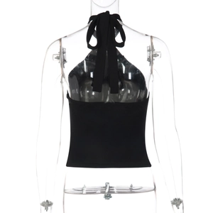 Detail of black halter tie-up backless top showing adjustable straps on a white background