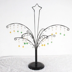 Black tree-shaped metal jewelry display stand with star top and hooks on round base