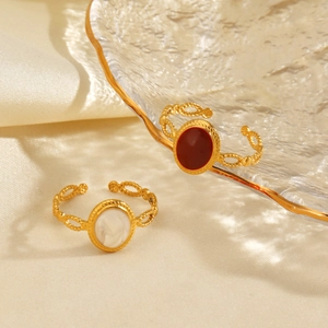 Minimalist geometric oval rings with red and white shell inlay on gold stainless steel