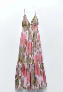 Detail of V-neck tie-dye slip dress with thin straps and layered ruffle hemline