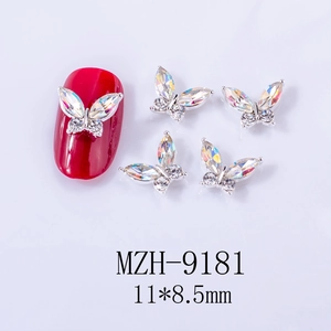 Detail of 11x8.5mm silver alloy butterfly nail charms with aurora rhinestones on red tips