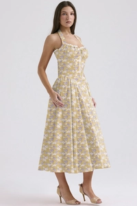 Detail of yellow floral maxi dress showing halter neck with delicate lace trim