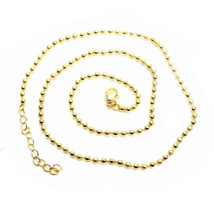 Detail of 45cm golden bead chain showing secure lobster clasp and adjustable tail chain