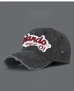 Close-up of vintage washed baseball cap featuring Orlando embroidery and distressed holes
