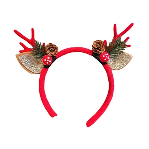 Red Christmas reindeer antler headband with pine cones and gold glitter ears on white background